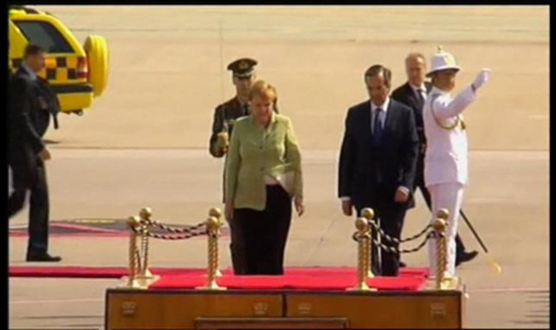 Merkel pisa Atenas